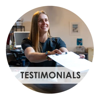 Chiropractic Whitefish MT Testimonials Assistant Handing over Paperwork